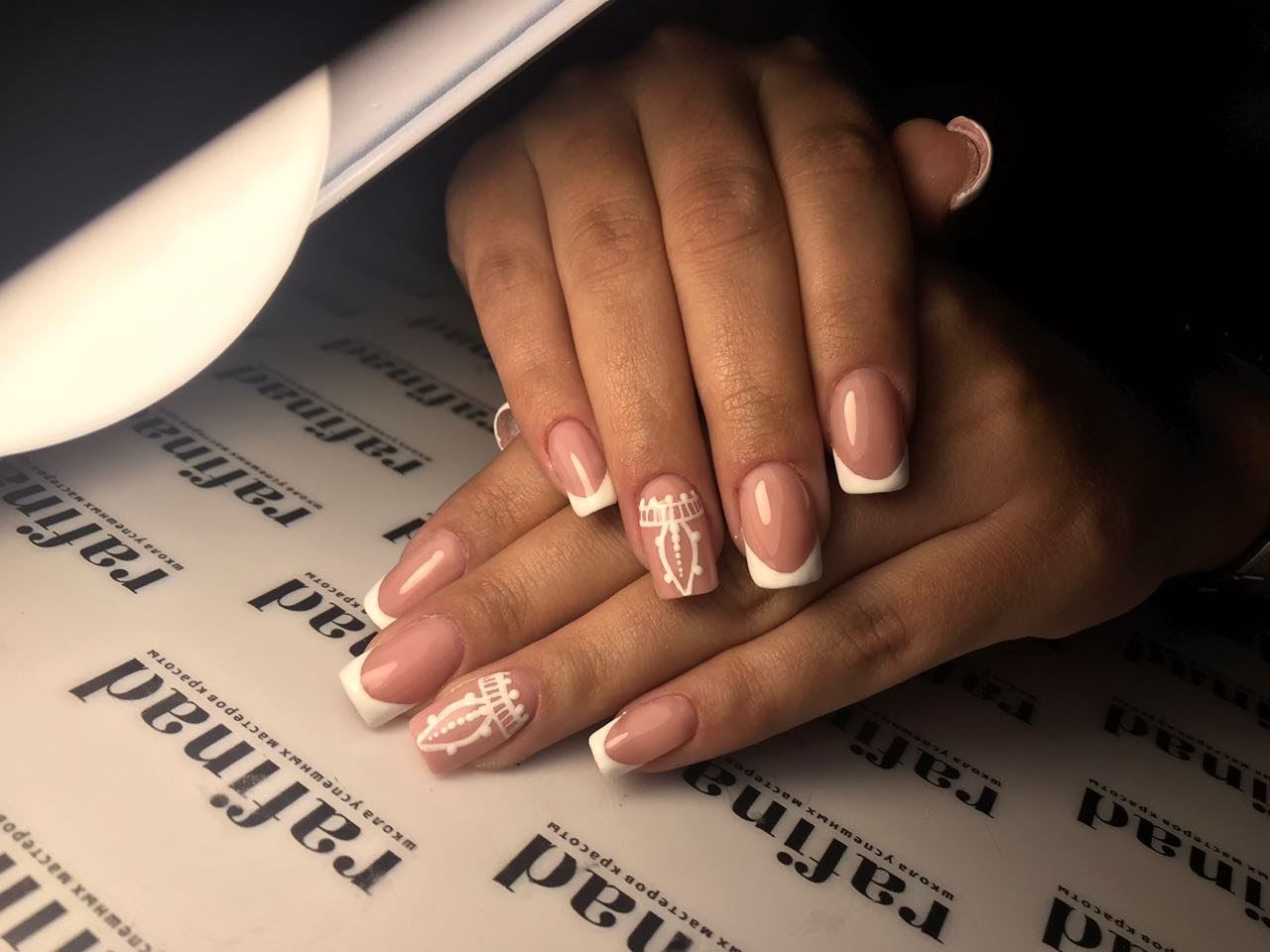 Daria's pink French manicure with hand-painted white details